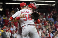 St. Louis Cardinals' Andrew Knizner and Ryan Helsley celebrate after defeating the Milwaukee Brewers in a baseball game to win the National League Central title Tuesday, Sept. 27, 2022, in Milwaukee. (AP Photo/Morry Gash)