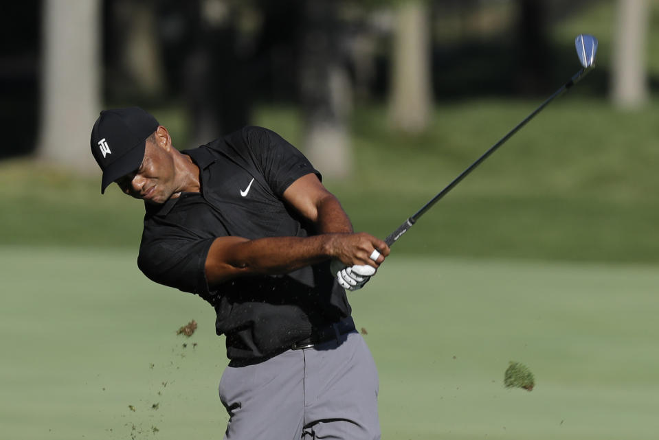 Tiger Woods hits from the 13th fairway during a practice round for the Memorial golf tournament, Tuesday, July 14, 2020, in Dublin, Ohio. (AP Photo/Darron Cummings)
