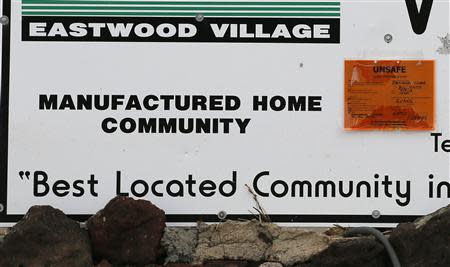 A sign outside Eastwood Village indicates houses in the neighborhood as "unsafe" in Evans, Colorado September 23, 2013. REUTERS/Rick Wilking