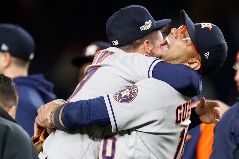 Jose Altuve and Yuli Gurriel celebrate after the final out.