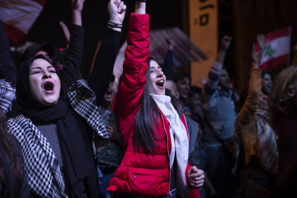 Anti-government protesters take part in a rally in Martyrs' Square in Beirut, Lebanon, Sunday, Dec. 22, 2019. (AP Photo/Maya Alleruzzo)