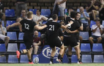 New Zealand's Will Jordan, right, is congratulated by teammates after scoring his second try during the Tri-Nations rugby test between Argentina and the All Blacks in Newcastle, Australia, Saturday, Nov. 28, 2020. (AP Photo/Rick Rycroft)