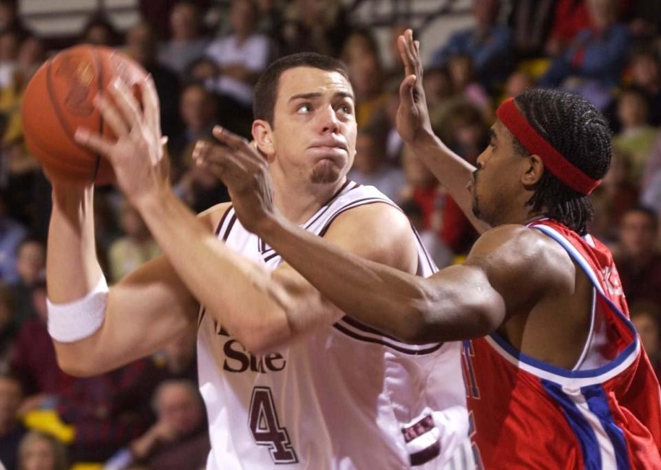 Missouri State's Drew Richards takes the ball up against Detroit Mercy's Torvoris Baker Saturday night at Hammons Student Center. Photo/Christina Dicken/News-Leader