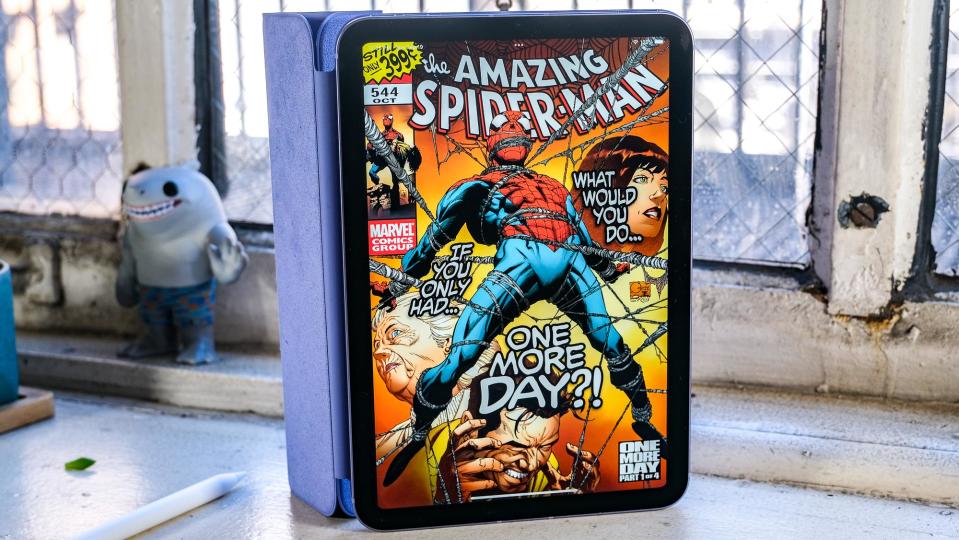 The iPad mini 2021 with a Spider-Man comic open