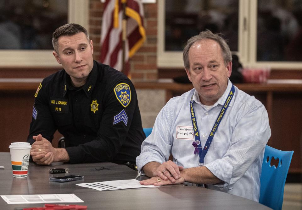 Sgt. John Cihanek of the Putnam County Sheriff's Department and Dan Brown, Principal at the Kent Primary School in Carmel, attend a forum at Carmel High School March 1, 2023 after several high school students produced a a series of TikTok videos with racist language and threats of gun violence. Parents, school administrators, and members of the Putnam County Sheriffs Department attended the forum.