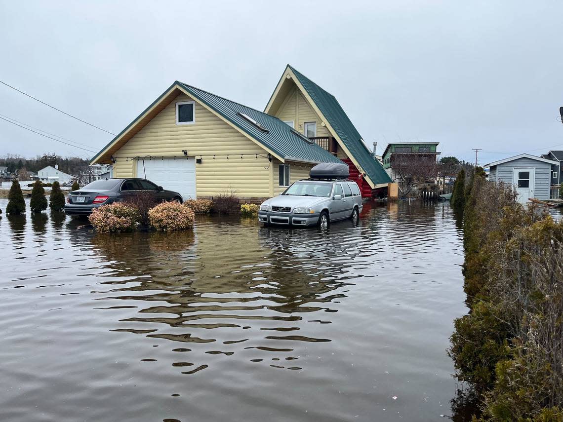 Flood waters threaten homes near Sucia Drive and Thetis Street on Sandy Point Thursday, Dec. 29, northwest of Bellingham.