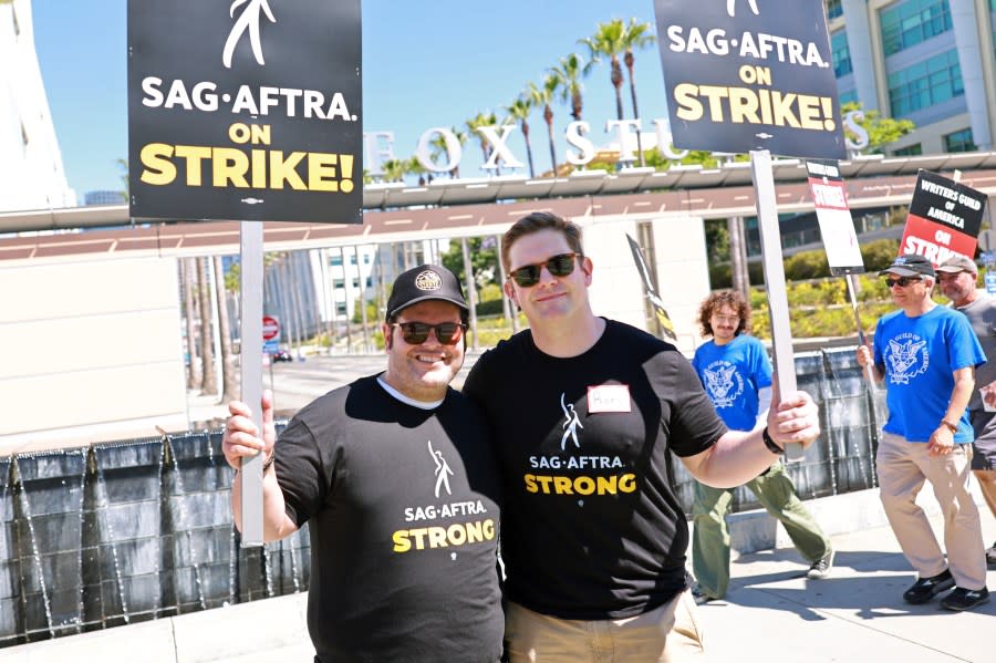 Josh Gad and Rory O'Malley join SAG-AFTRA and WGA members as they walk the picket line outside Fox Studios on July 14, 2023 in Los Angeles, California. (Matt Winkelmeyer/Getty Images)