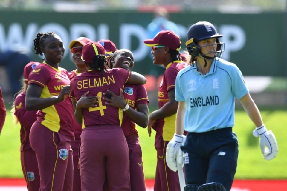 West Indies players celebrate the dismissal of England's Amy Jones (AFP via Getty Images)
