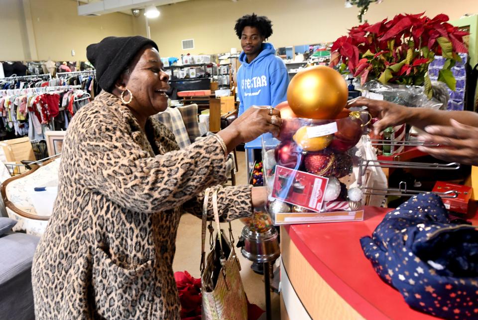 Georgia Bell spreads a little Christmas cheer at Temporary Emergency Services Thrift Store. TES has been helping the Tuscaloosa community for more than 80 years.