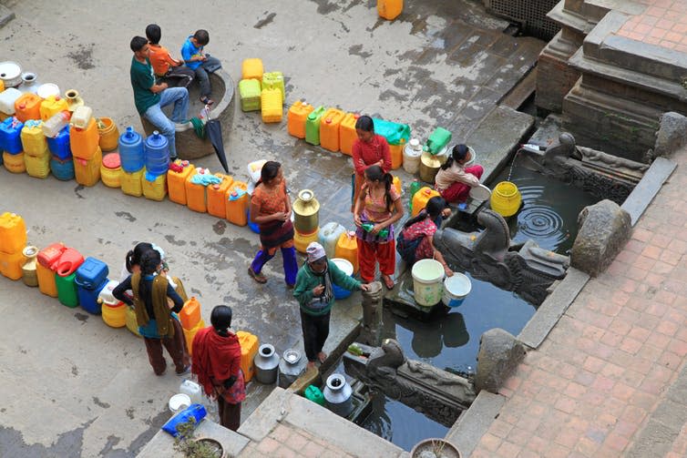 <span class="caption">Collecting water in Patan, Nepal.</span> <span class="attribution"><a class="link " href="https://www.shutterstock.com/download/confirm/249411661?src=hLjcbue6Ag6fhQX3p2AWrw-1-11&size=medium_jpg" rel="nofollow noopener" target="_blank" data-ylk="slk:sasimoto/Shutterstock.com;elm:context_link;itc:0;sec:content-canvas">sasimoto/Shutterstock.com</a></span>