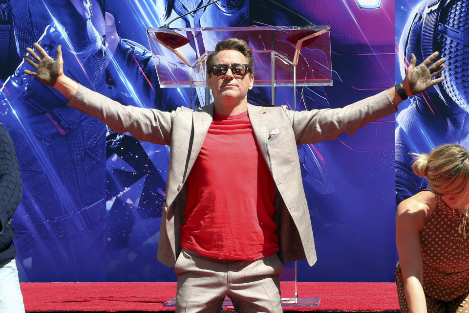 Robert Downey Jr., member of the cast of "Avengers: End Game" shows his hands after placing them in cement during a hand and footprint ceremony at the TCL Chinese Theatre on Tuesday, April 23, 2019, in Los Angeles. (Photo by Willy Sanjuan/Invision/AP)