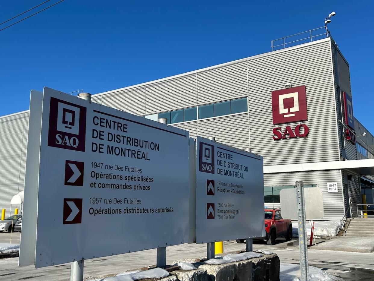 Expansion work was paused at Montreal's SAQ warehouse after two groups demand an excavation be done. It was once an informal cemetery for an asylum. (Rowan Kennedy/CBC - image credit)