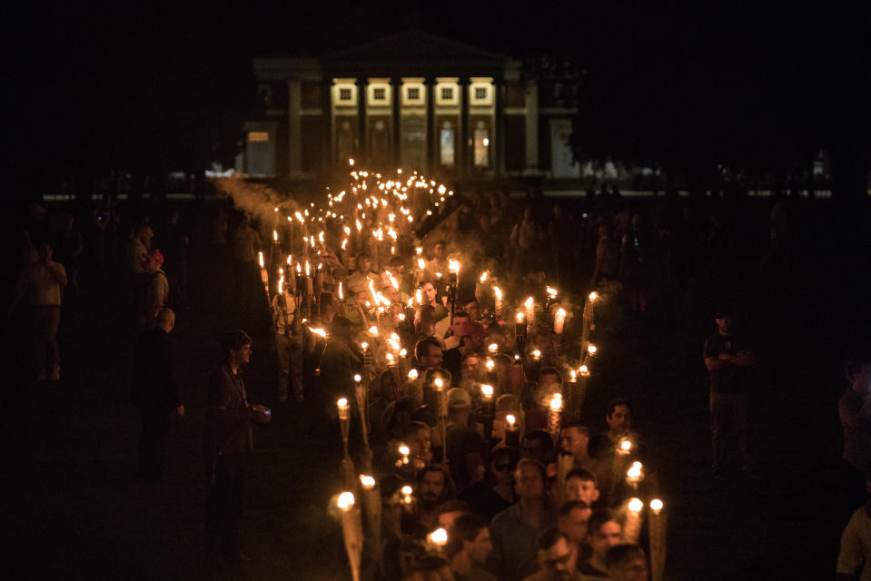 <p>Chanting “White lives matter! You will not replace us! and Jews will not replace us!,” several hundred white nationalists and white supremacists carrying torches marched in a parade through the University of Virginia campus in Charlottesville, Va., on Aug. 11, 2017. (Photo: Evelyn Hockstein/For The Washington Post via Getty Images) </p>