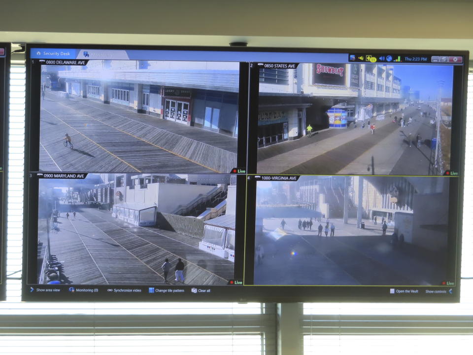 Video screens inside the surveillance center of the Atlantic City, N.J., police department show street scenes being live-streamed from locations around the city on Nov. 16, 2023. The city plans to add hundreds of additional security cameras to the 3,000 that already keep an electronic eye on the seaside gambling resort. (AP Photo/Wayne Parry)