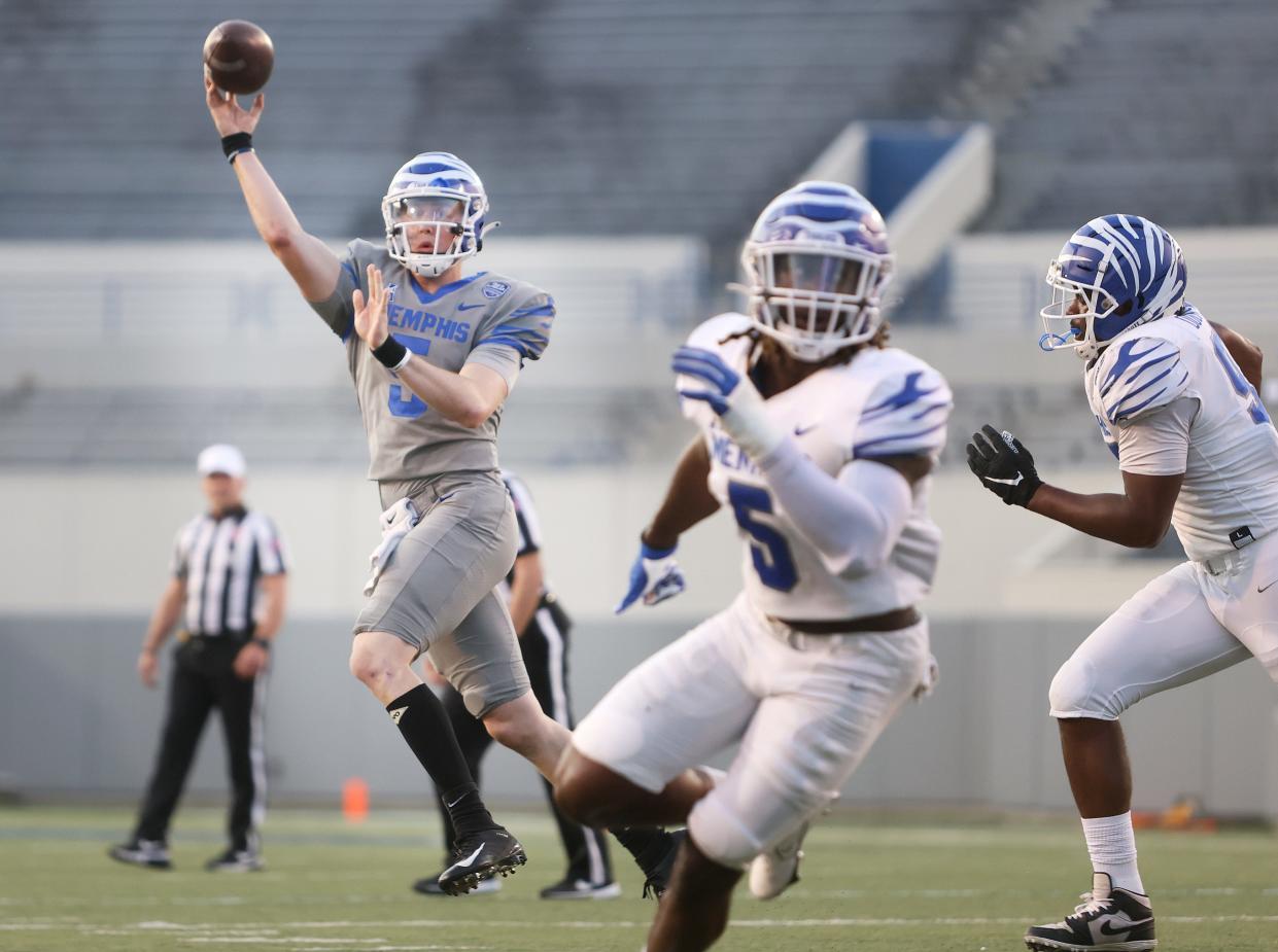 Memphis Tigers quarterback Seth Henigan throws the ball during the Friday Night Stripes spring football game at Liberty Bowl Memorial Stadium on Friday, April 22, 2022. 