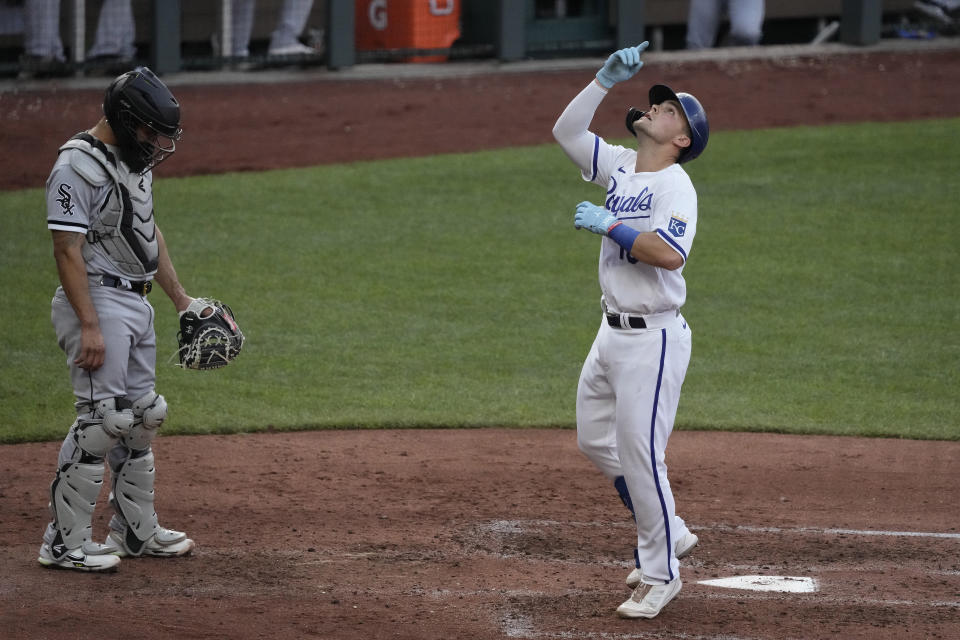 Kansas City Royals' Michael Massey, right, celebrates as he crosses the plate after hitting a solo home run during the fourth inning of a baseball game against the Chicago White Sox Wednesday, May 10, 2023, in Kansas City, Mo. (AP Photo/Charlie Riedel)