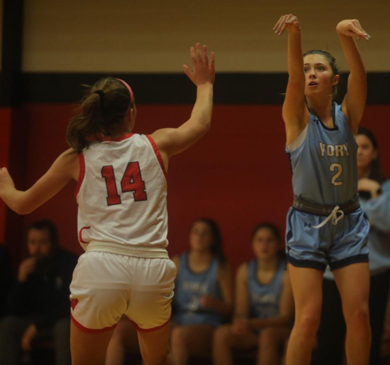 York High School girls basketball player Emma Joyce getting a 3-point shot up during Thursday's Class B South loss to Wells, 51-31 at Wells High School