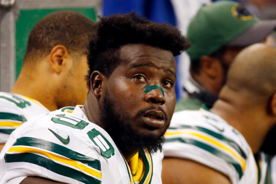 Green Bay Packers defensive tackle Letroy Guion sits on the bench during a 2015 game against the Detroit Lions. The former Packers defensive player was sentenced to one year in jail after pleading no contest in a domestic violence assault at his home last fall. Brown County Circuit Court Judge Thomas Walsh also ordered Guion to serve three years' probation and complete a domestic violence intervention program.