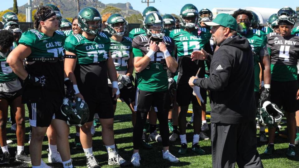 Cal Poly head football coach Beau Baldwin wraps up a practice in March 2021.