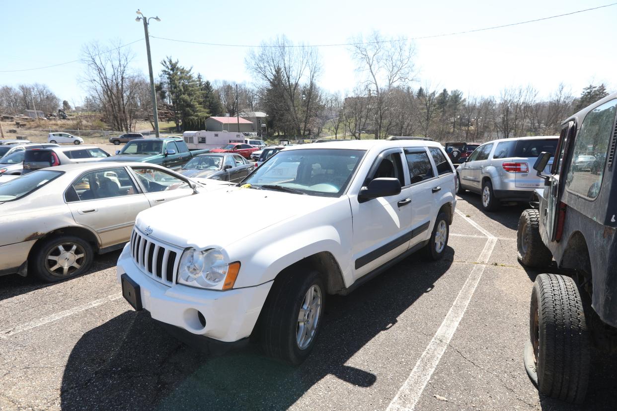 A Jeep is among the dozens of vehicles being auctioned off at the Zanesville Police Department impound lot on Saturday. For more photos visit zanesvilletimesrecorder.com.