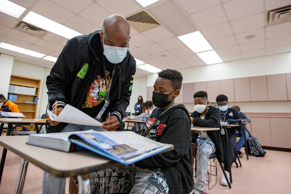 Students work on a civics packet in a new pilot program at Nims Middle School the helps overage fifth graders students speed through sixth grade and catch up to their peers Thursday, Jan. 20, 2022.