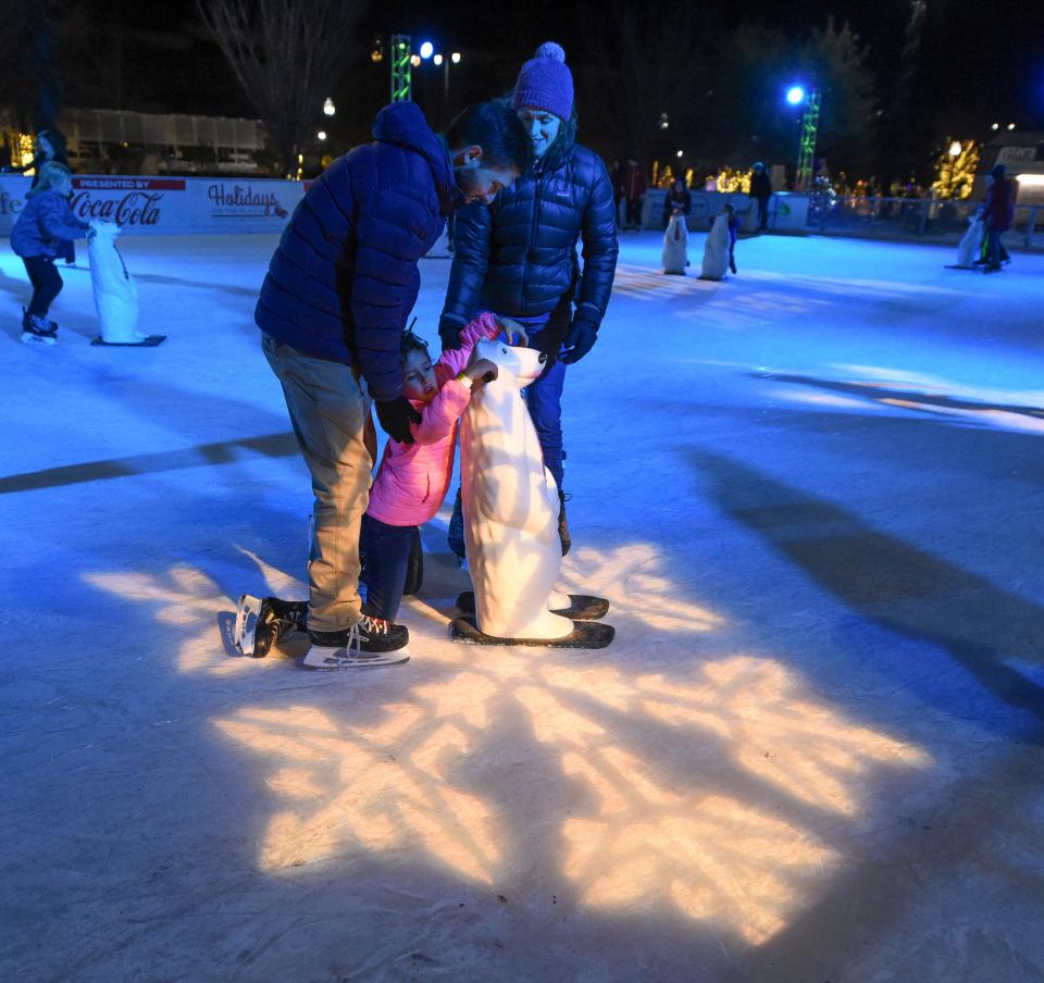 Dec 15, 2022; Tuscaloosa, Alabama, USA;  Skaters enjoy the ice rink which is part of the Holidays on the Plaza at Government Plaza in Tuscaloosa.