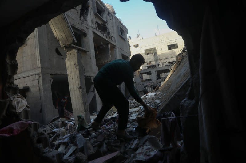 Palestinians salvage belongings in the aftermath of an Israeli strike in Rafah in southern Gaza Strip, Sunday, December. 24, 2023. UNRWA says it "cannot deliver meaningful aid" under intense Israeli bombardments of Gaza after the UN Security Council called for increased access. Photo by Ismael Mohamad/UPI
