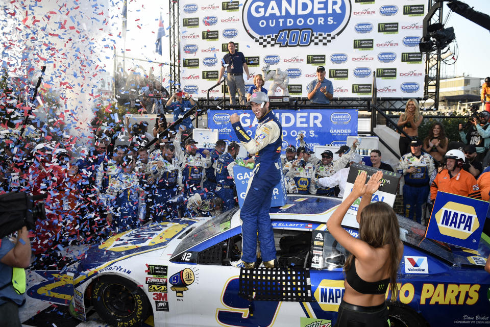 Chase Elliott, center, celebrates in Victory Lane after he won a NASCAR Cup Series auto race, Sunday, Oct. 7, 2018, at Dover International Speedway in Dover, Del. (AP Photo/Nick Wass)