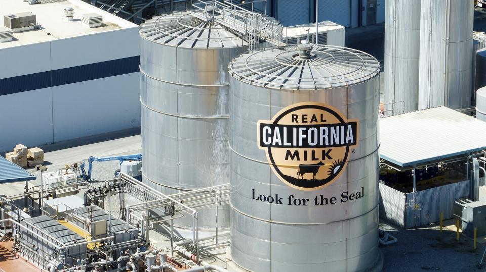 Tanks stand at California Dairies Inc. on Monday, May 20, 2024, in Pixley, Calif. Industrial-scale dairy farms already are among the biggest polluters in the San Joaquin Valley, a premier U.S. agricultural region with poor air quality. (AP Photo/Noah Berger)