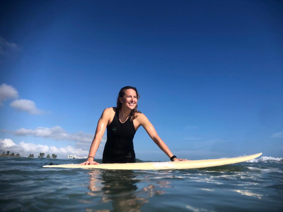 Laurie K. Blandford in her element, surfing at Fort Pierce Inlet State Park.