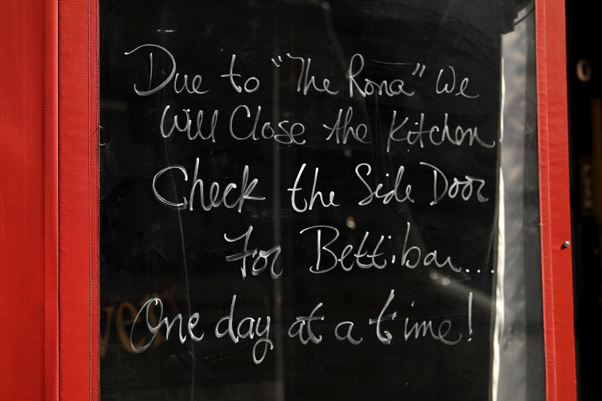 NEW YORK, NEW YORK  - MARCH 16:  A notice posted in the window of Hourglass Tavern on Manhattan's Restaurant Row notes that the kitchen is closed as coronavirus cases and fears continue to spread on March 16, 2020 in New York City. The World Health Organization declared COVID-19 a global pandemic on March 11. (Photo by Dia Dipasupil/Getty Images)
