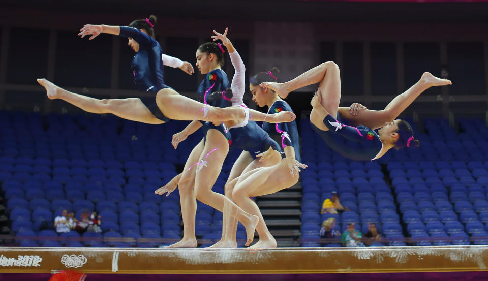 Zoi Mafalda Marques de Lima of Portugal attends a gymnastics training session at the O2 Arena before the start of the London 2012 Olympic Games July 26, 2012. This picture was taken using multiple exposures. REUTERS/Brian Snyder (BRITAIN - Tags: SPORT OLYMPICS SPORT GYMNASTICS) 