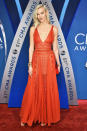 <p>Having just run the New York Marathon, Kloss cleaned up nicely in a sheer red dress. (Photo: Getty Images) </p>