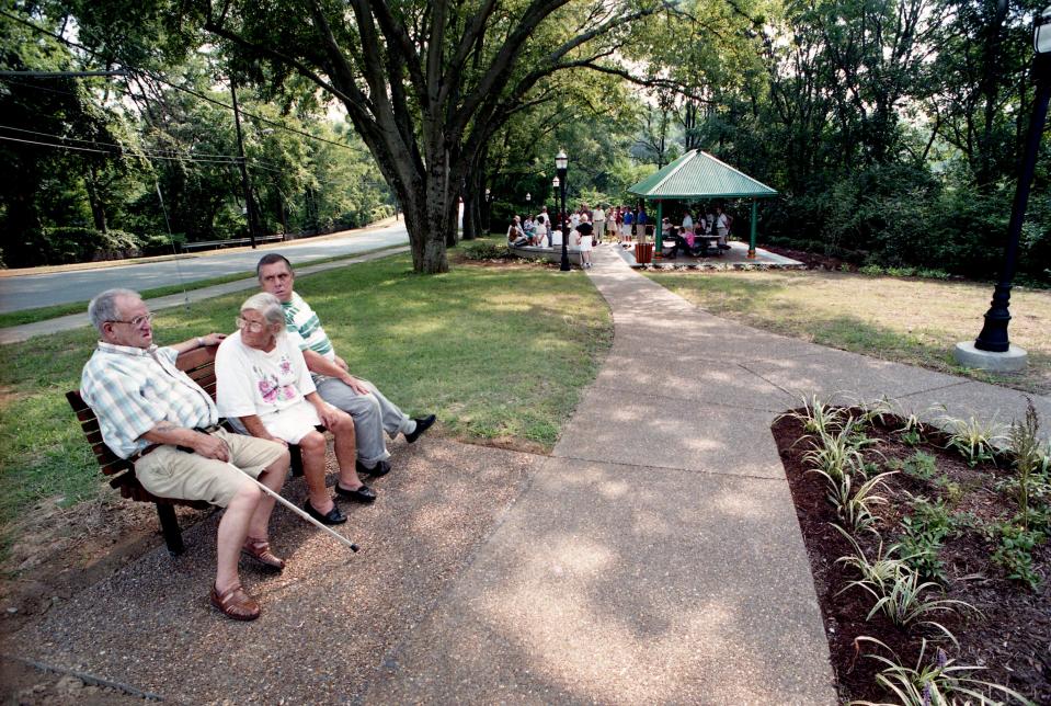 Herschel Howard Palmer, left, his wife, Lucille, and Ronnie Barnes enjoy the new Shelby Place Park as the dedication ceremonies for the greenway take place Aug. 26, 1995. The Palmers live across the street from the pocket park in East Nashville.