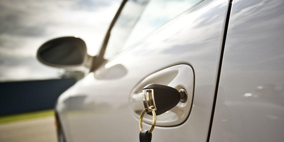 car at a car dealership with a key