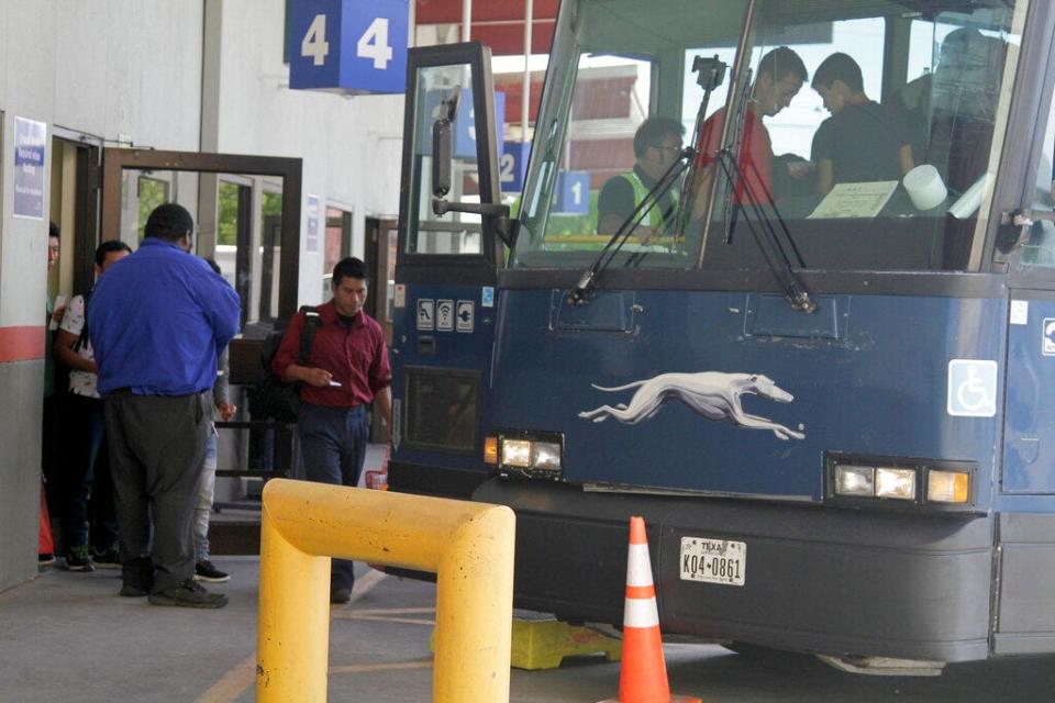 In this April 2, 2019, file photo, an asylum seeker from Guatemala boards a Greyhound bus in El Paso, Texas.