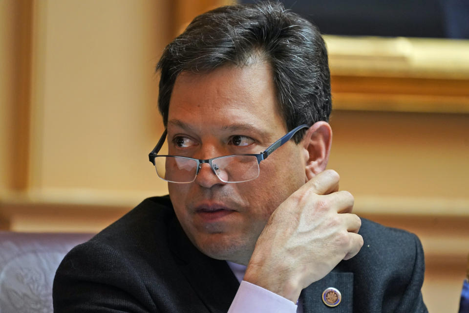 FILE - Virginia state Sen. Scott Surovell, D-Fairfax, listens to debate during the Senate session at the Capitol, March 10, 2022, in Richmond, Va. Gov. Youngkin announced Wednesday, June 5, 2024 that Virginia will abandon California's stringent vehicle emissions rules aimed at reducing carbon pollution at the end of the year when that state’s current regulations expire, citing an attorney general opinion. Surovell said via text message. “The governor is breaking the law and the AG is giving him cover.” (AP Photo/Steve Helber, File)