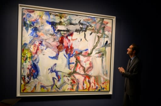 An art expert from Sotheby's talks about Willem de Kooning's "Untitled XXII" during an auction preview November 1, 2019 at Sotheby's in New York