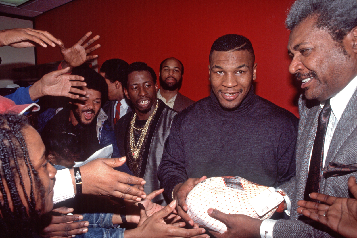 Mike Tyson and Don King distribute turkeys for Thanksgiving Day