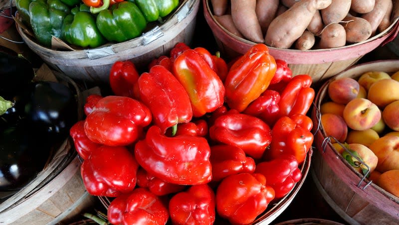 Freshly picked farm grown bell peppers are ready to be chosen by customers at Brenda's Produce stand in Jackson, Miss., Tuesday, July 14, 2015.