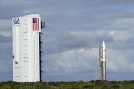 United Launch Alliance Atlas V rocket with the Lucy spacecraft aboard is rolled out of the Vertical Integration Facility to the launch pad at Space Launch Complex 41 at the Cape Canaveral Space Force Station, Thursday, Oct. 14, 2021, in Cape Canaveral, Fla. The robotic trailblazer named Lucy is slated to blast off on Saturday on a 12-year cruise to unexplored swarms of asteroids out near Jupiter.. (AP Photo/John Raoux)