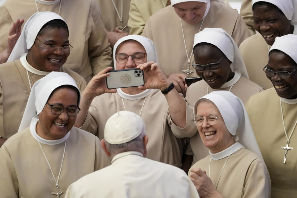 Pope Francis meets a group of nuns during his weekly general audience in the Pope Paul VI hall at the Vatican, Wednesday, Aug. 30, 2023. (AP Photo/Andrew Medichini)