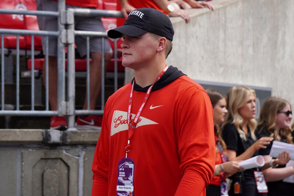 Nate Roberts, a 2025 tight end prospect out of Washington, Oklahoma, speaks with OSU coach Ryan Day prior to the Buckeyes' game against Western Kentucky on Sept. 16, 2023.