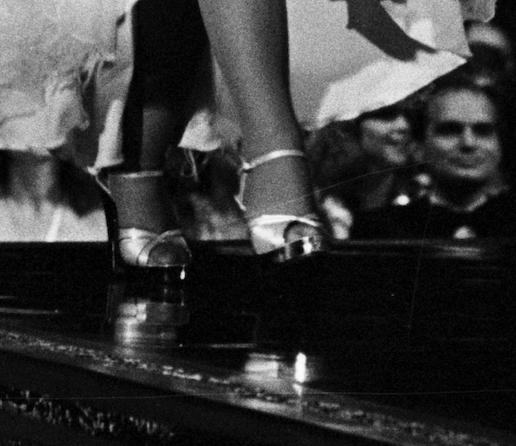 Dolly Parton in strappy-heeled sandals at the Rock Awards in 1977.<cite>Getty Images</cite>