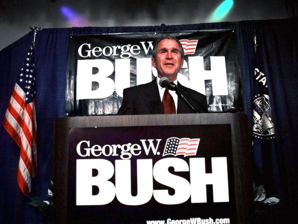 Texas Gov. and Republican presidential hopeful George W. Bush smiles from the podium as he addresses supporters during a campaign stop in Portland, Ore., Wednesday, July 7, 1999