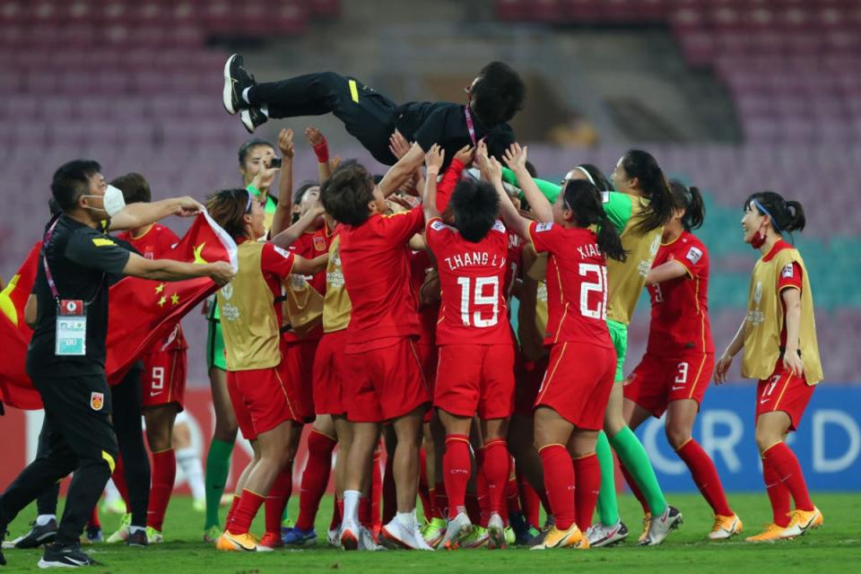 China celebrate by throwing Shui Qingxia into the air after winning the Asian Cup (Getty Images)