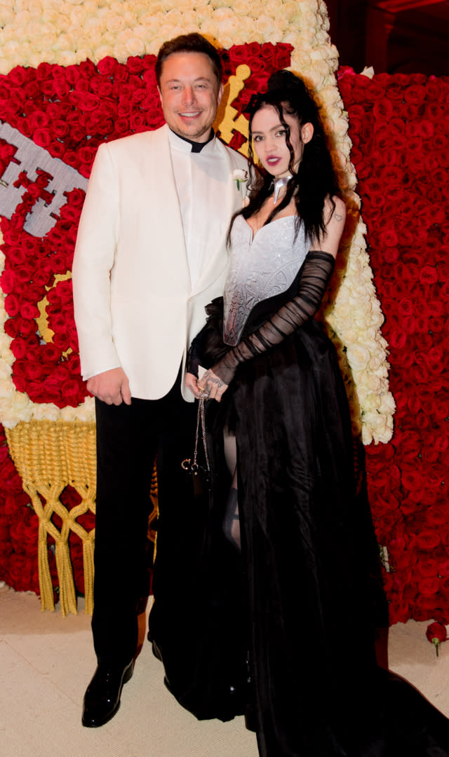 NEW YORK, NY – MAY 07: Elon Musk and Grimes attend the Heavenly Bodies: Fashion & The Catholic Imagination Costume Institute Gala at The Metropolitan Museum of Art on May 7, 2018 in New York City. <em>Photo by Kevin Tachman/Getty Images for Vogue.</em>