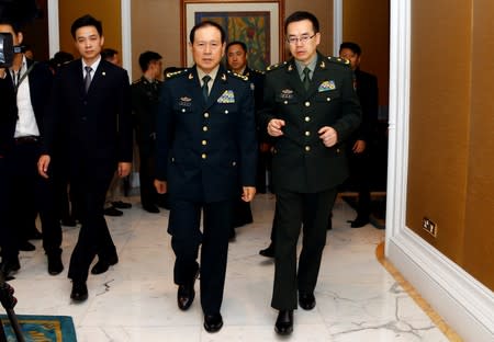 Chinese Defense Minister Wei Fenghe arrives for a meeting on the sidelines of the IISS Shangri-la Dialogue in Singapore