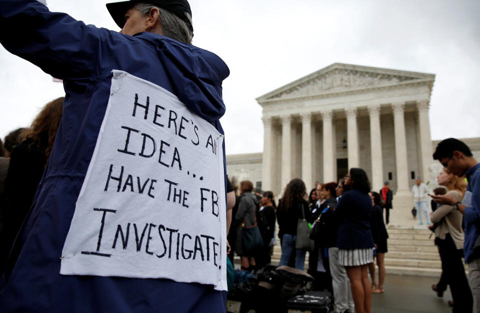 Demonstrators protest against Supreme Court nominee Brett Kavanaugh in front of the Supreme Court building in Washington on Monday. (Photo: Joshua Roberts / Reuters)