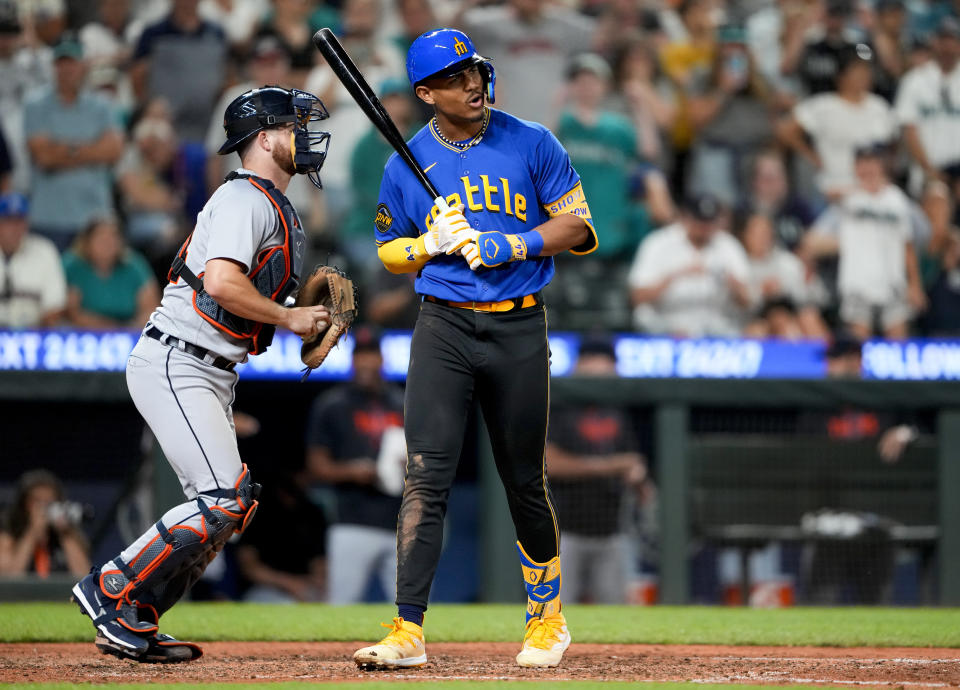 Seattle Mariners' Julio Rodriguez reacts to striking out looking to end the baseball game, next to Detroit Tigers catcher Jake Rogers on Friday, July 14, 2023, in Seattle. Detroit won 5-4. (AP Photo/Lindsey Wasson)